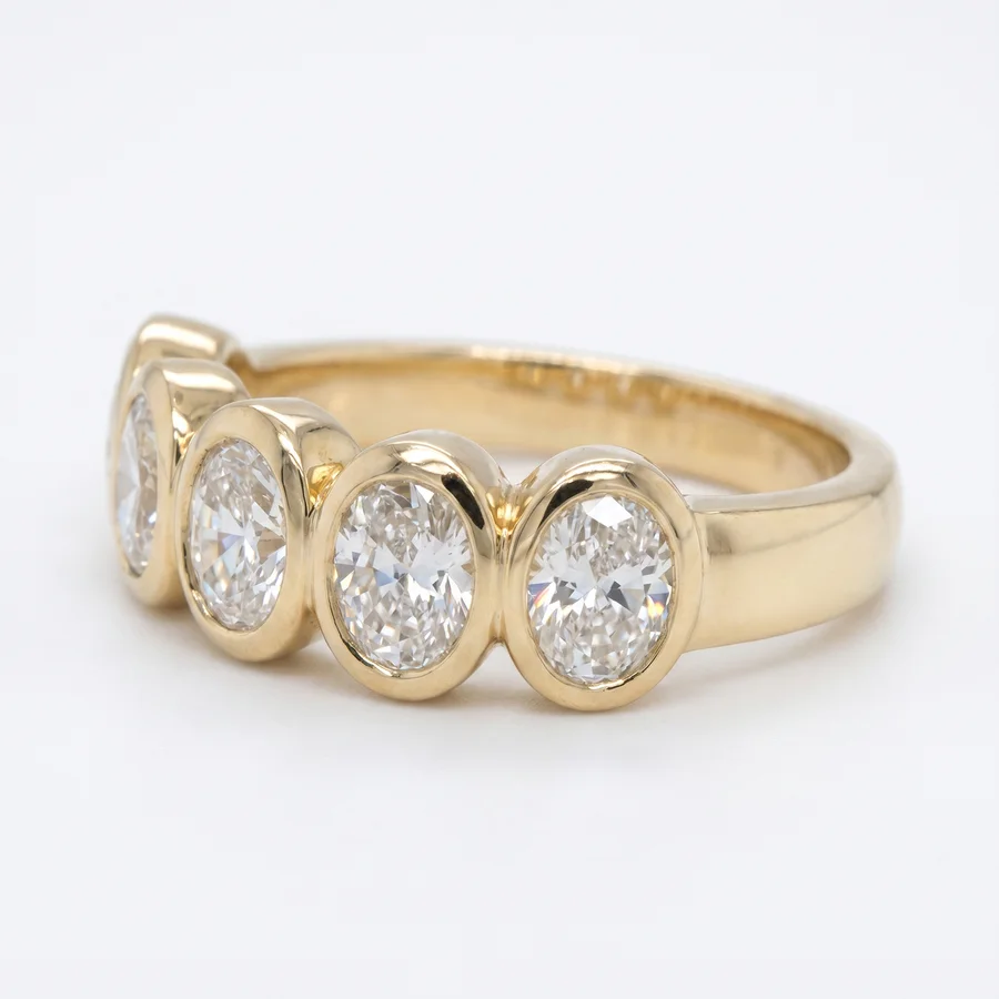 Yellow gold oval diamond anniversary band from Zak's Jewelry, photographed by Aurix