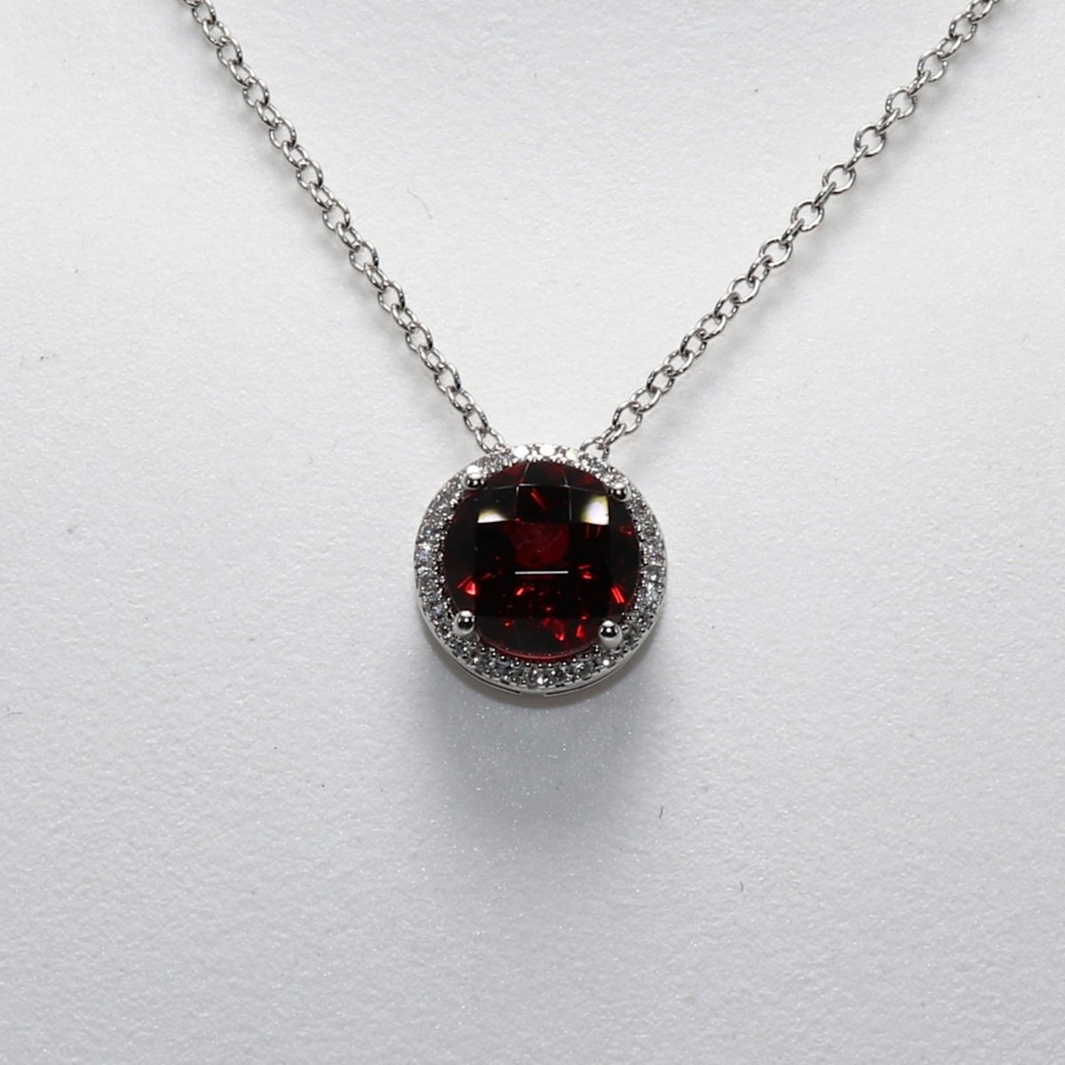 Original counter photo of a Garnet halo pendant